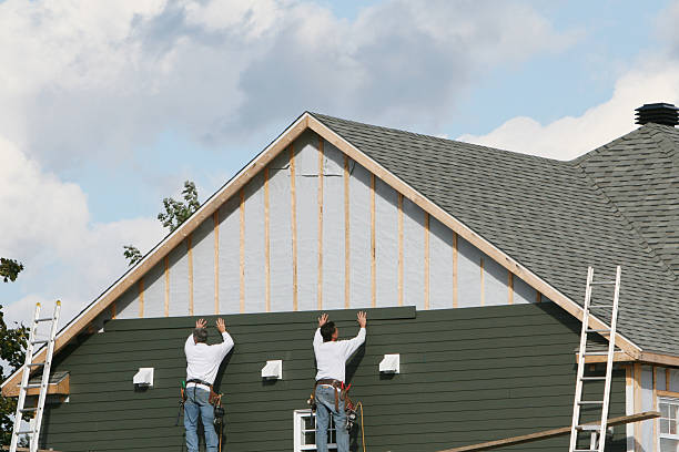 Professional Siding technician working in Jordan, NY